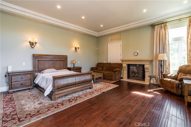 bedroom with hardwood / wood-style floors and ornamental molding