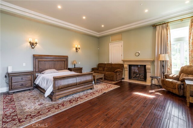 805 W Road Ln, Habra Heights, CA 90631 - bedroom featuring hardwood / wood-style floors, a glass covered fireplace, crown molding, and recessed lighting