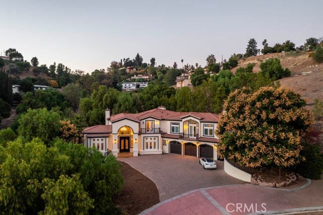 805 W Road Ln, Habra Heights, CA 90631 - mediterranean / spanish home featuring french doors, driveway, a chimney, and an attached garage