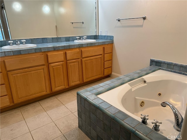 bathroom with a relaxing tiled tub, tile patterned floors, and vanity