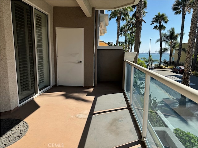 balcony featuring a water view