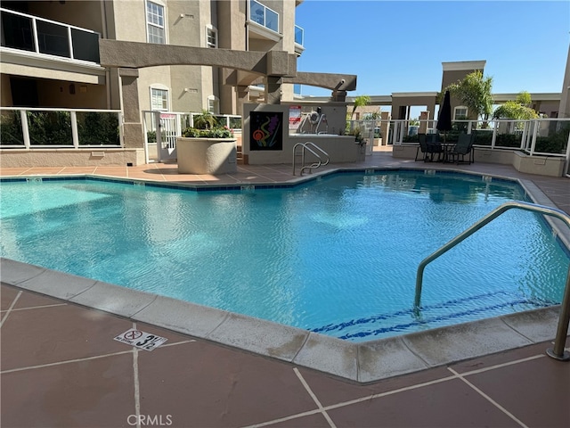 view of pool with a patio