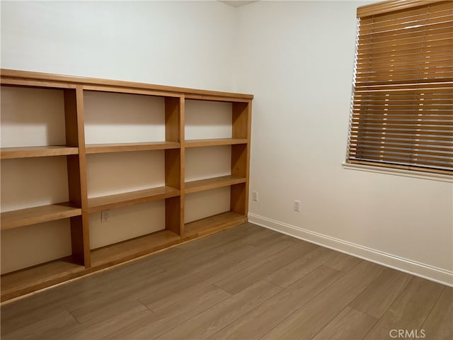 empty room with wood-type flooring