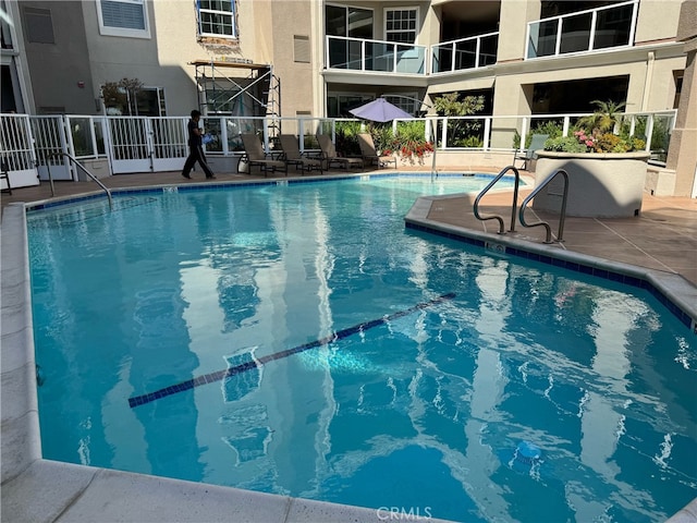 view of pool featuring a patio