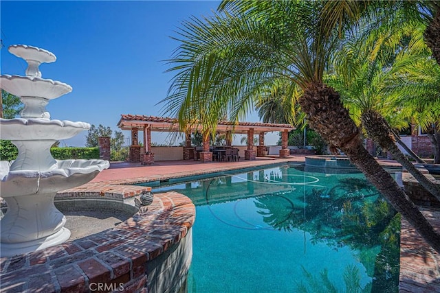 view of swimming pool featuring a patio