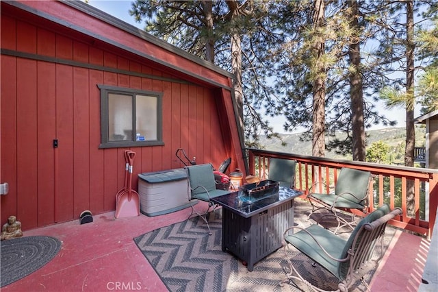 30897 Glen Oak Dr, Running Springs, CA 92382 - wooden terrace featuring an outdoor fire pit