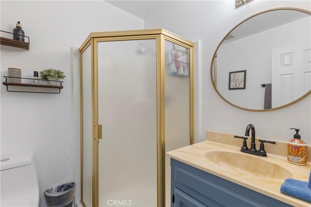 30897 Glen Oak Dr, Running Springs, CA 92382 - full bathroom featuring vanity, a stall shower, and toilet