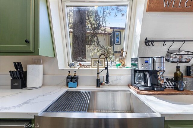 30897 Glen Oak Dr, Running Springs, CA 92382 - kitchen view of green cabinets, a sink, and light stone countertops