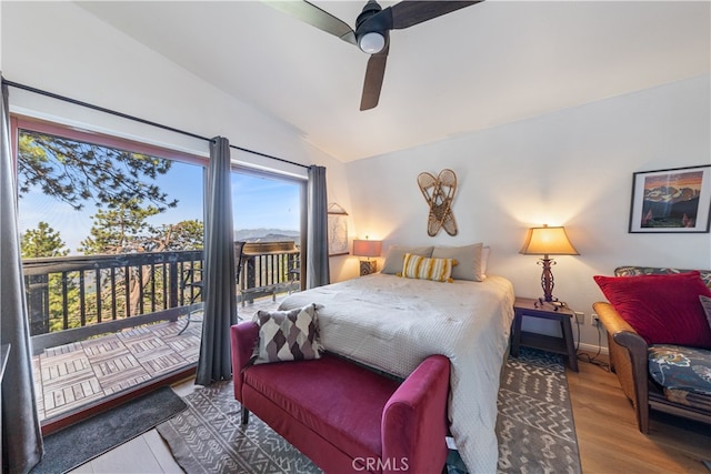 bedroom with light hardwood / wood-style flooring, vaulted ceiling, ceiling fan, and access to exterior