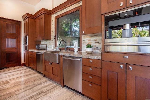 649 Seabright Ln, Solana Beach, CA 92075 - kitchen featuring stainless steel appliances, a sink, brown cabinets, tasteful backsplash, and a warming drawer