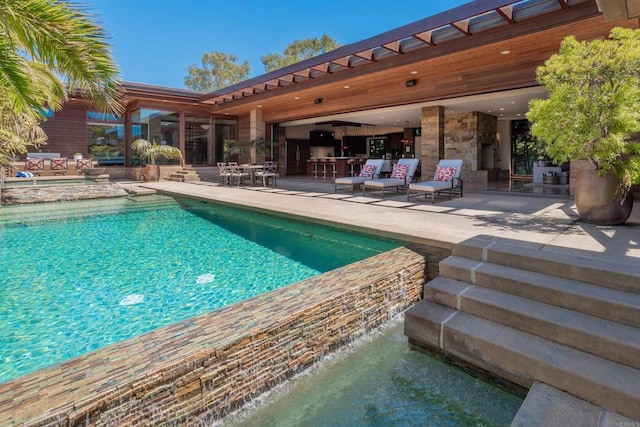 view of swimming pool with a patio area and an outdoor living space