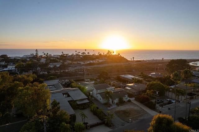 aerial view at dusk with a water view