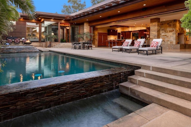 view of swimming pool featuring a patio area