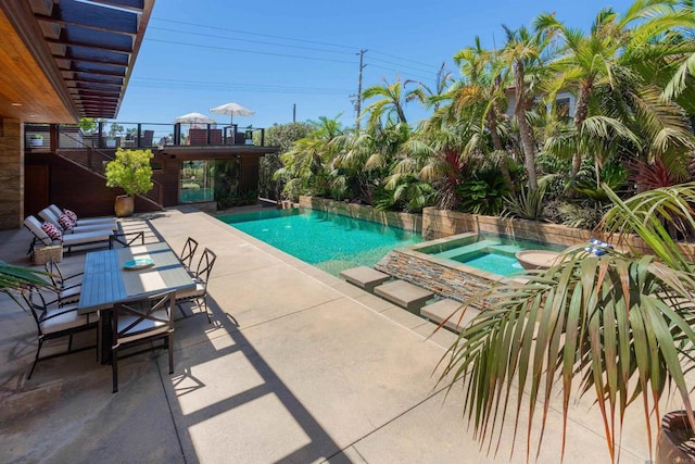 view of pool featuring an in ground hot tub and a patio area