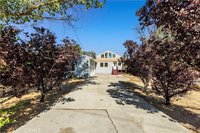 view of front of home featuring concrete driveway