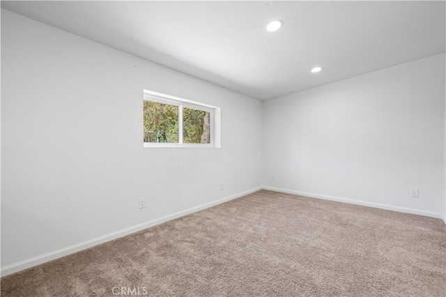 unfurnished room featuring carpet flooring