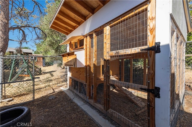 view of side of home with an outdoor structure