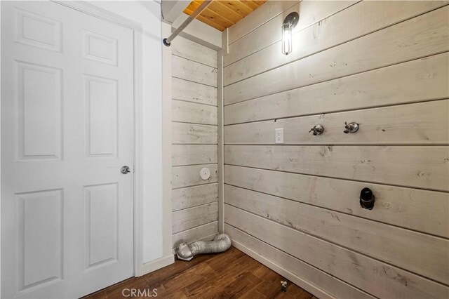 room details with wooden ceiling, wood walls, and hardwood / wood-style flooring