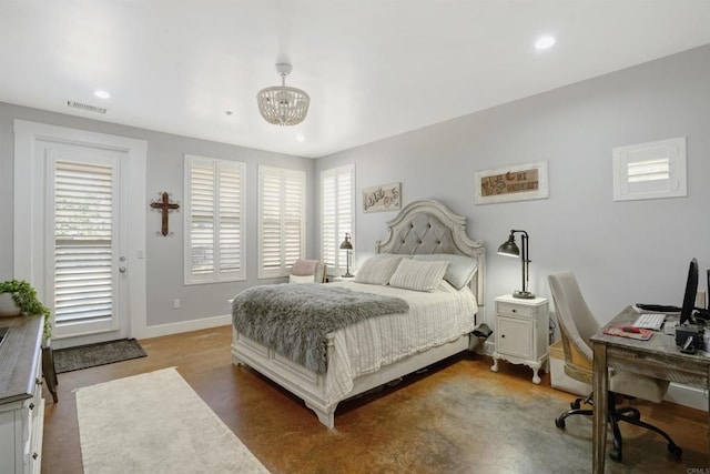 bedroom with a notable chandelier