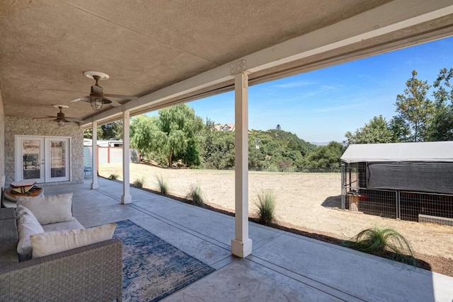 view of patio featuring a storage unit and ceiling fan