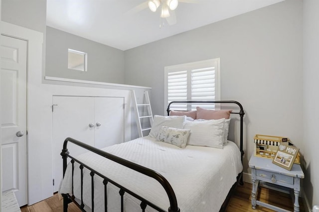 bedroom with hardwood / wood-style floors and ceiling fan