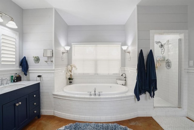 bathroom with vanity and separate shower and tub