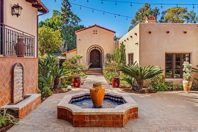 view of front of home with a patio