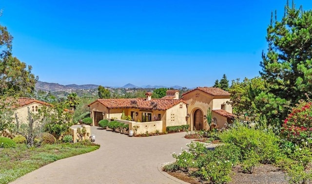 mediterranean / spanish home featuring a mountain view