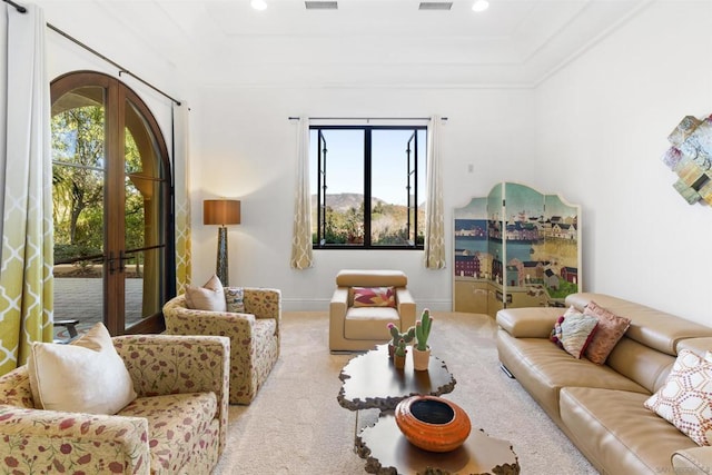 carpeted living room with french doors