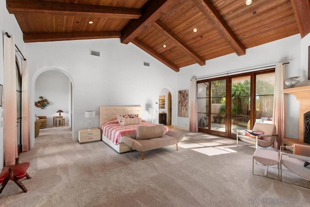 carpeted bedroom featuring access to exterior, high vaulted ceiling, beam ceiling, and wooden ceiling