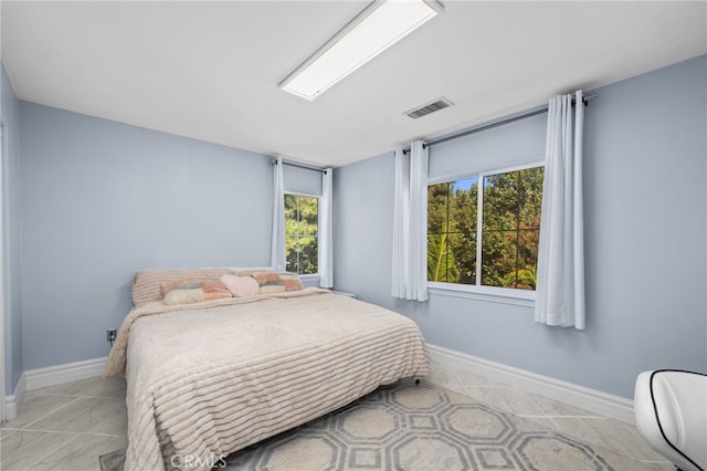 bedroom with multiple windows