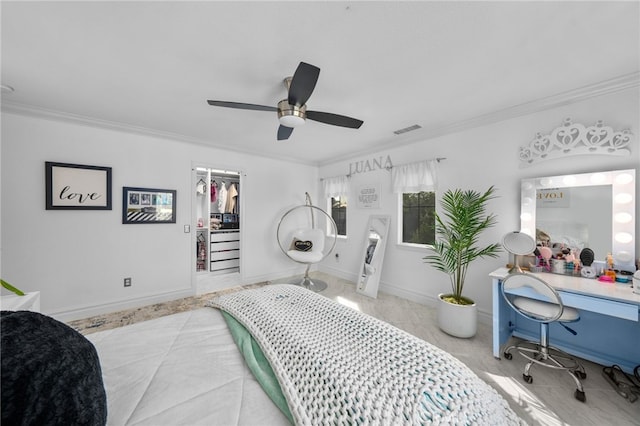 bedroom featuring ornamental molding, a closet, and ceiling fan