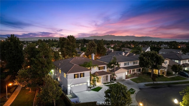 aerial view at dusk with a mountain view