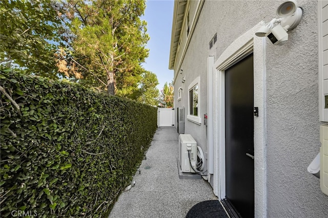 view of side of property with ac unit