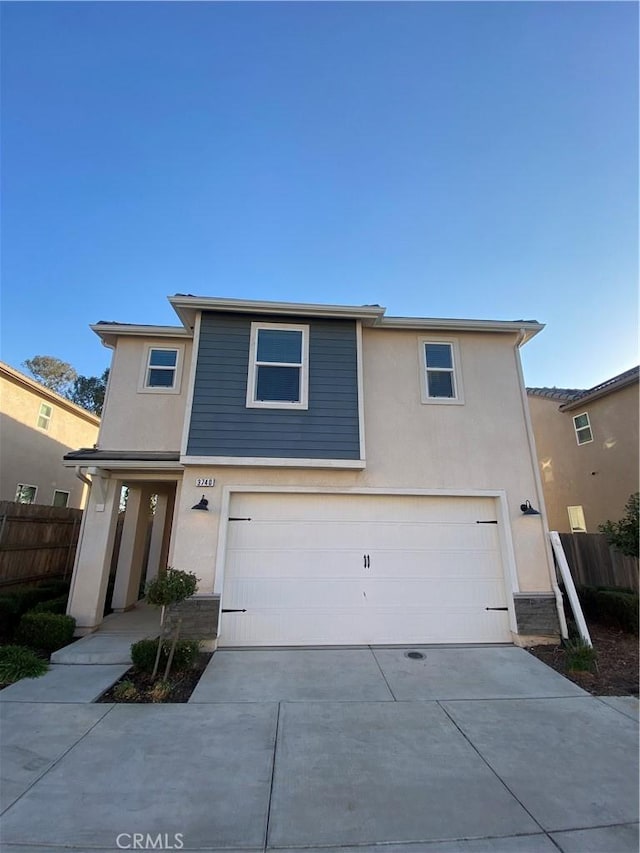 view of front of property with a garage