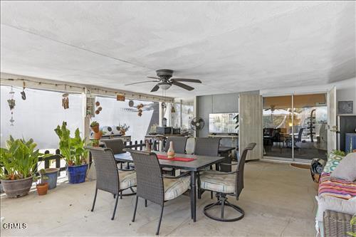 view of patio featuring ceiling fan