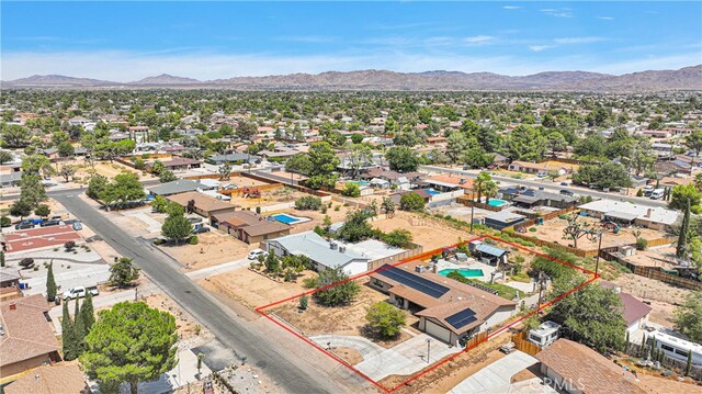 drone / aerial view featuring a mountain view