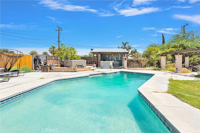 view of swimming pool featuring a patio area