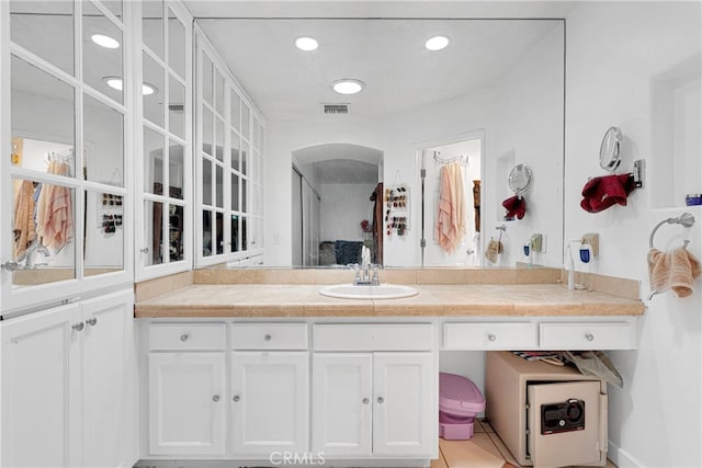 bathroom with tile patterned flooring and vanity