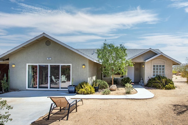 back of property featuring a patio area