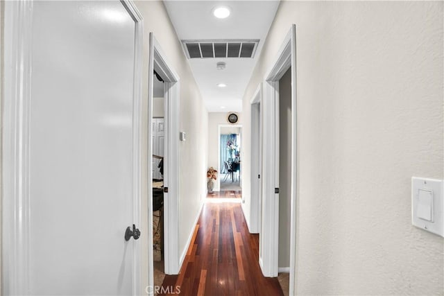 hallway featuring dark hardwood / wood-style floors