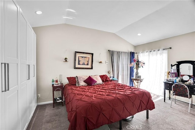 bedroom featuring dark carpet and vaulted ceiling