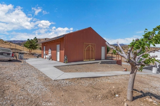 view of outbuilding with a mountain view