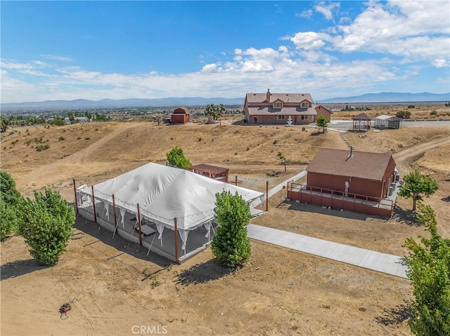 drone / aerial view featuring a mountain view