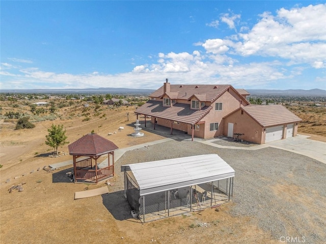 birds eye view of property featuring a mountain view