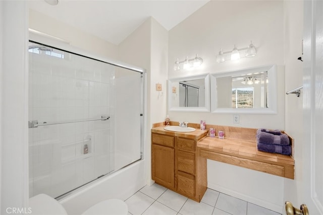 full bathroom featuring tile patterned floors, vanity, vaulted ceiling, shower / bath combination with glass door, and toilet