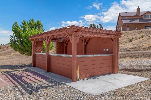 view of gate with a pergola