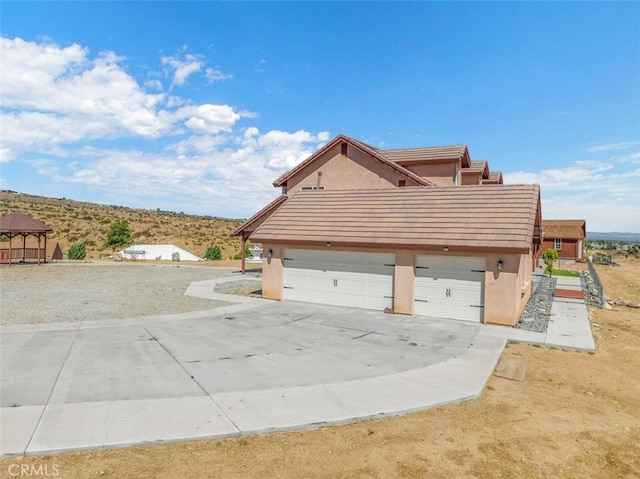 view of side of home featuring a garage