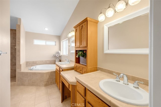 bathroom with tile patterned flooring, vanity, a relaxing tiled tub, and lofted ceiling