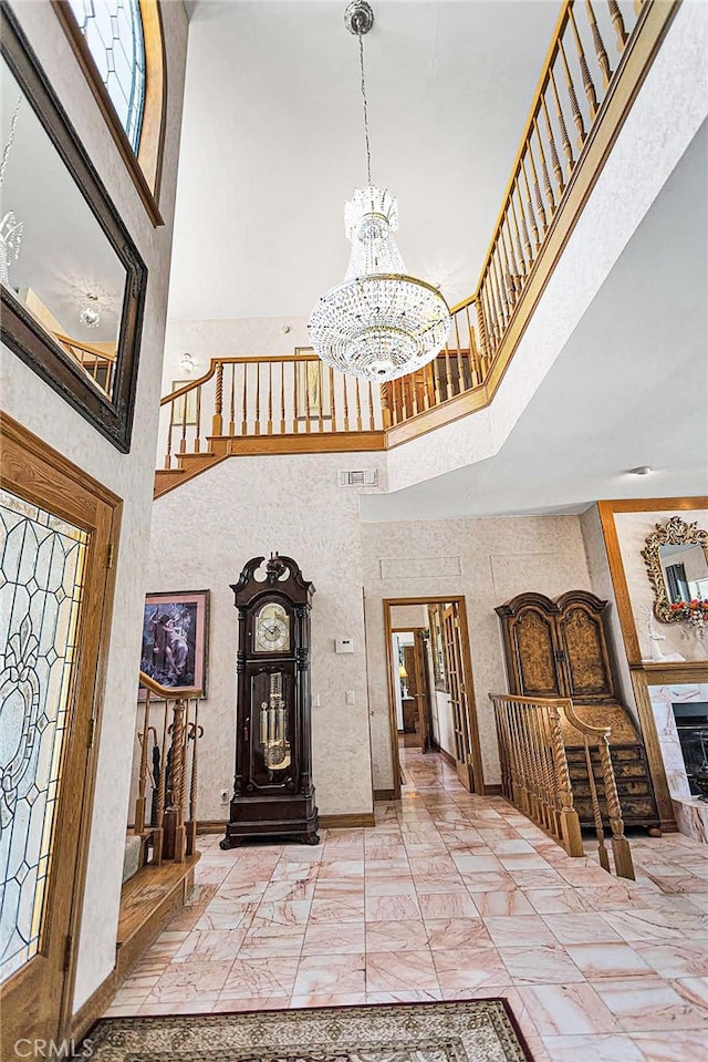 entryway with a chandelier and a high ceiling